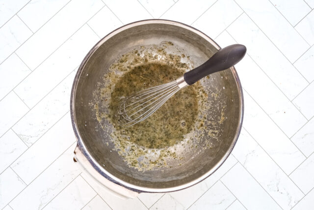 Air fryer meatball prep: combining egg, herbs, and panko.