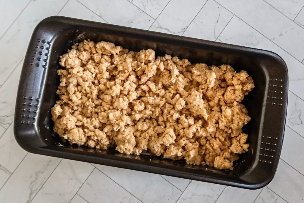 apple crips in a loaf pan ready to bake