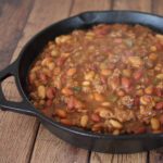 a skillet of cookout baked beans with ground beef