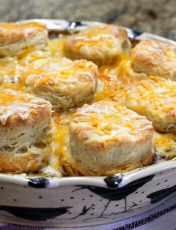 beef and bean casserole with biscuits and cheese topping