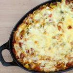 cabbage casserole with sausage in a baking dish