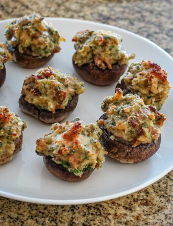 stuffed mushrooms with clams casino filling on a serving plate