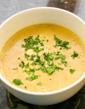 beer cheese soup with a variety of vegetables and cheddar cheese