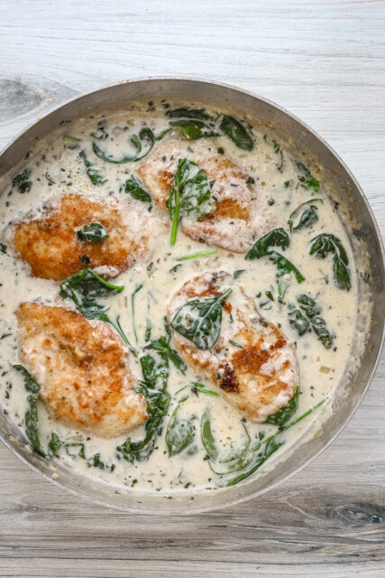Creamy chicken florentine recipe in a skillet, ready to serve and enjoy.