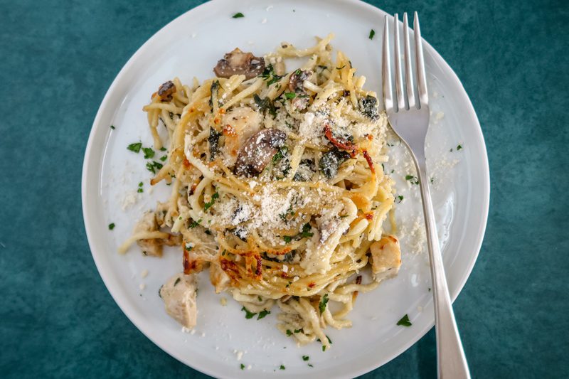 chicken tetrazzini serving on a plate with fork