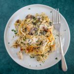 chicken tetrazzini with mushrooms, spinach, spaghetti, and parmesan cheese