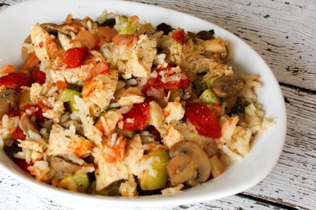 chicken, rice, and zucchini casserole with tomatoes and parmesan cheese