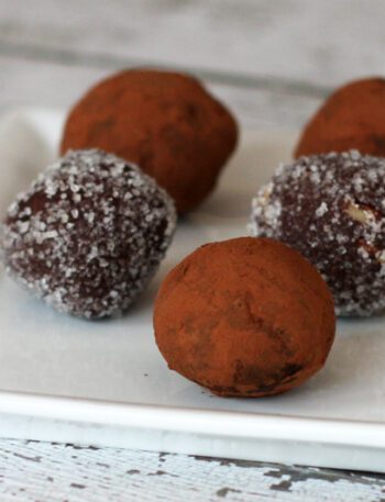 chocolate bourbon truffles on a plate with cocoa or sugar coating