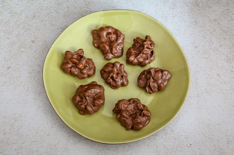 chocolate peanut clusters on a plate