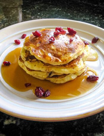 a stack of cranberry pancakes on a plate