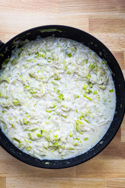 Add the cream and Parmesan cheese to the leeks and add salt and pepper to taste. Time to serve!