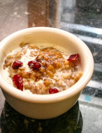 overnight oatmeal in a small bowl with dried cranberries