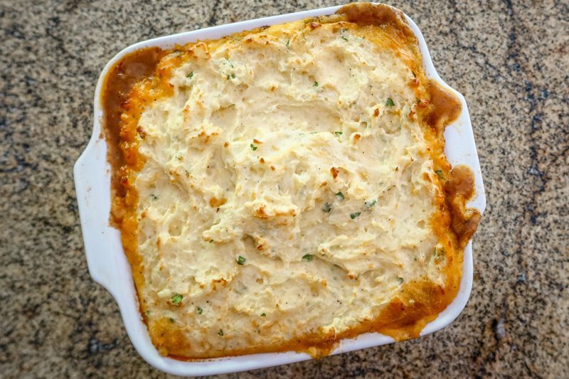 hot baked cottage pie in the baking dish