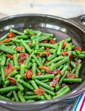 green beans with bacon in in a DVF serving dish