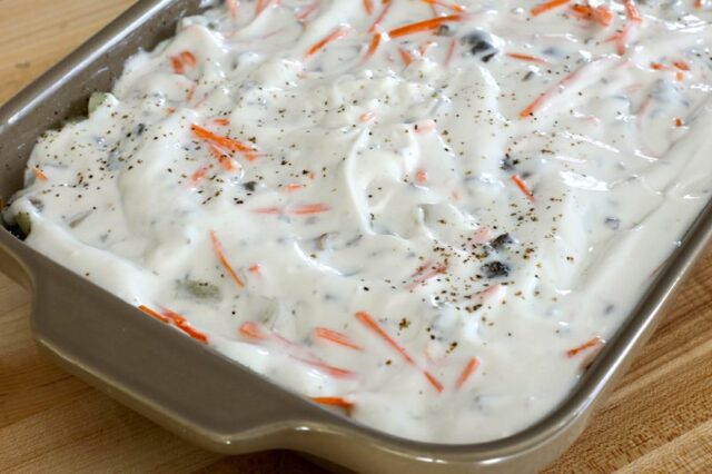 ground beef and potato bake preparation with sour cream sauce