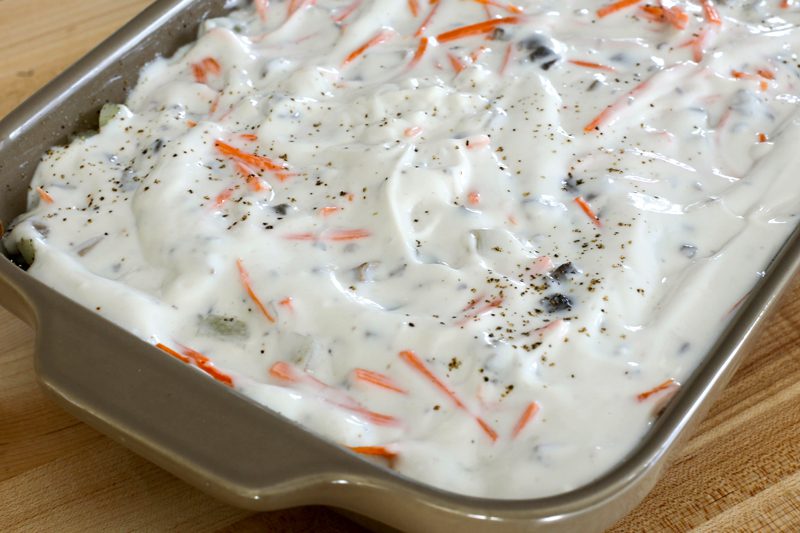 ground beef and potato bake preparation with sour cream sauce
