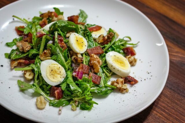 hard boiled quail eggs on an arugula salad