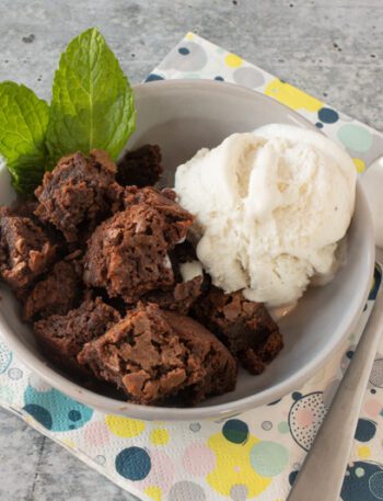 hot fudge cake cut into squares and served with vanilla ice cream