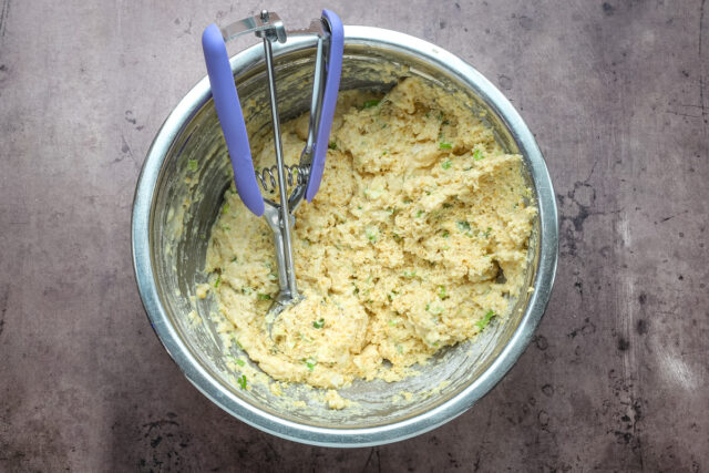 Hushpuppy preparation: making the batter with buttermilk and green onions.