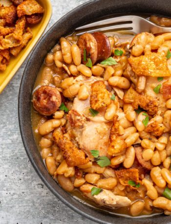 instant pot cassoulet with beans, chicken thighs, bacon, and smoked sausage