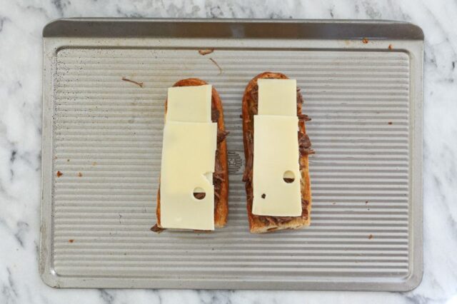 french dip prep: cheese layered on the beef
