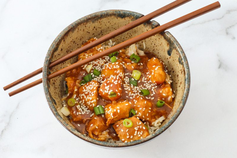 instant pot general tso's chicken in a bowl with chopsticks
