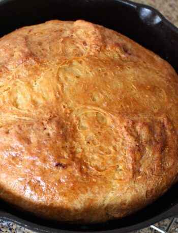 irish soda bread baked in a cast iron pan