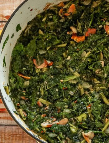dutch oven with a mess of kale and mustard greens with bacon