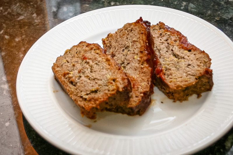 meatloaf with zucchini shown on a large plate