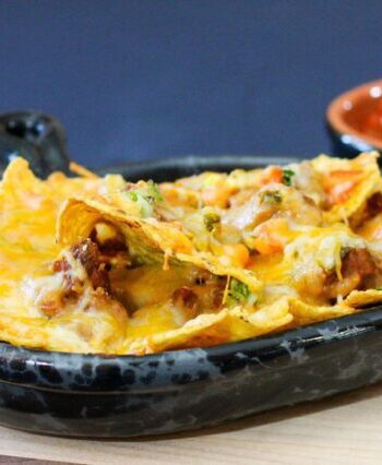 loaded nachos in a luncheon plate