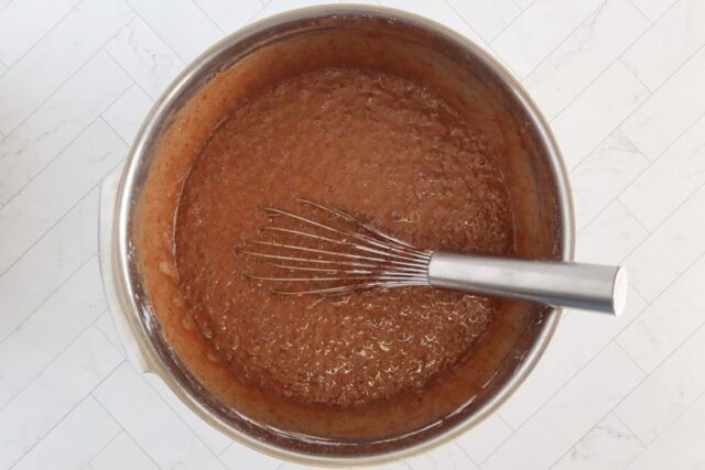 Whisking the chocolate cake batter.