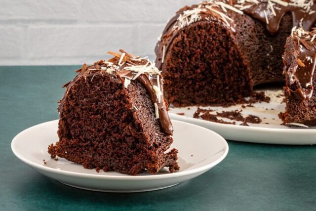 The cake sliced and shown on a plate.