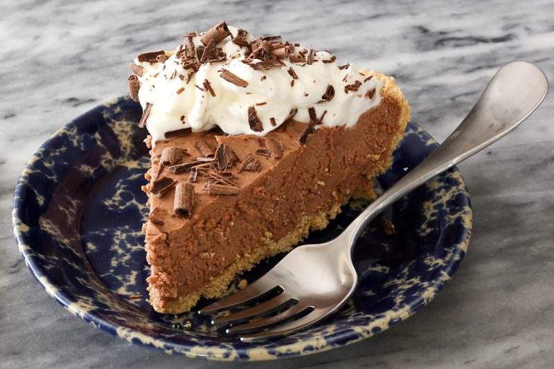 no bake chocolate cheesecake on a plate with fork