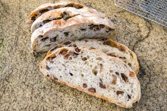 No knead kalamata bread sliced.