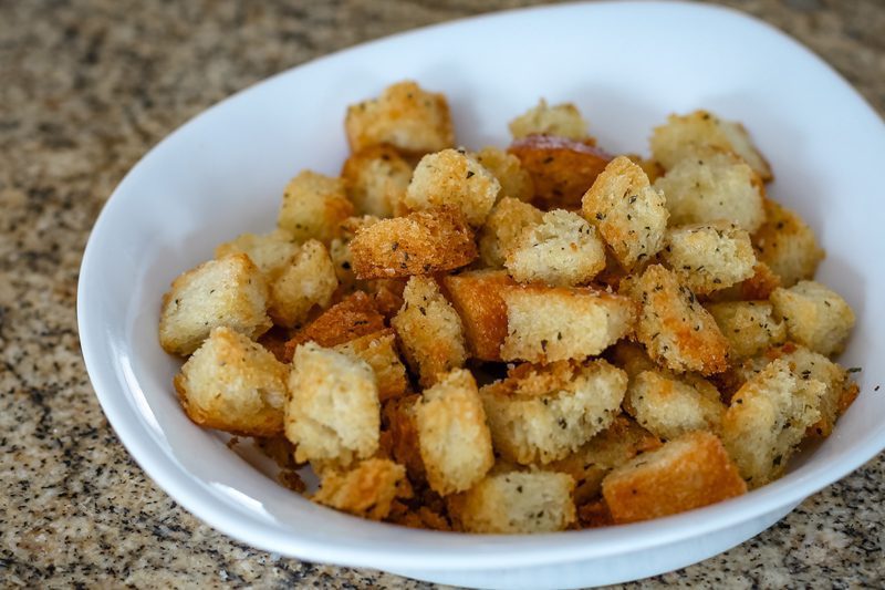 Seasoned croutons in a small bowl.