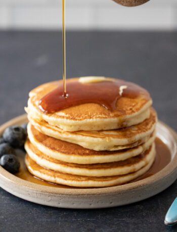 pancakes on a plate with maple syrup