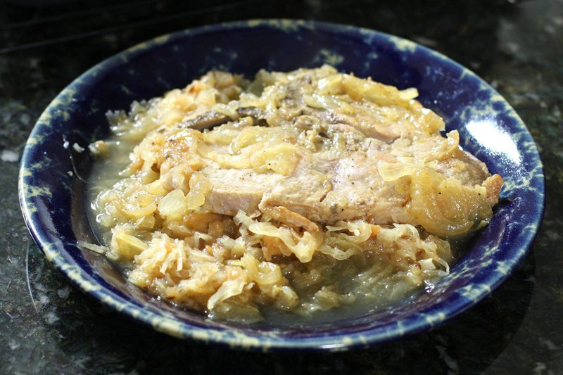 Baked pork chops with sauerkraut on a plate