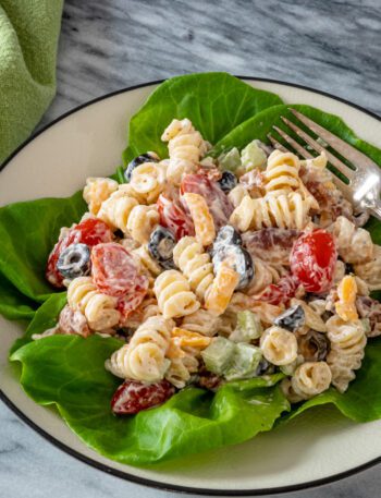 Ranch pasta salad served on a plate with lettuce leaves
