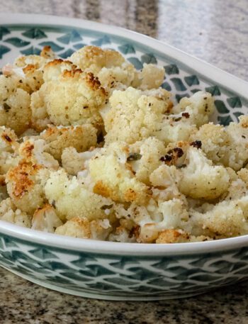 roasted cauliflower with lemon in a serving dish