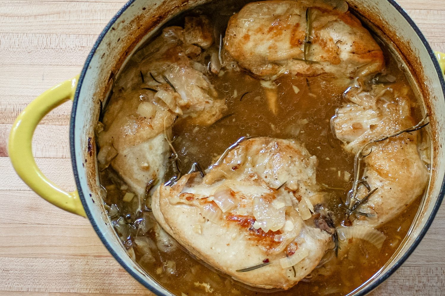braised chicken with rosemary in a dutch oven