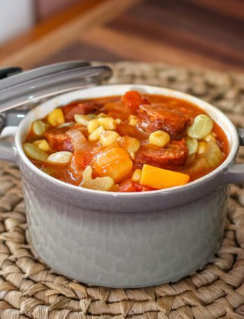 sausage and butternut squash stew with tomatoes and corn in a serving size cocotte