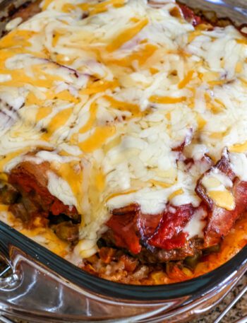 seven layer ground beef casserole with melted cheese on top