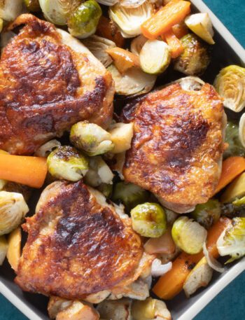 roasted chicken thighs with brussels sprouts and apples and carrots