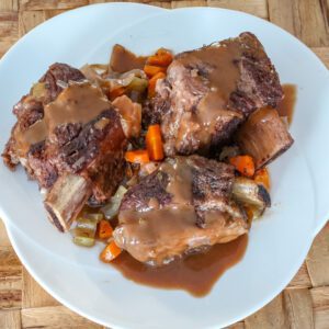 slow cooker short ribs on a serving platter