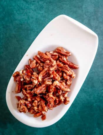 Spiced pecans on a serving dish.