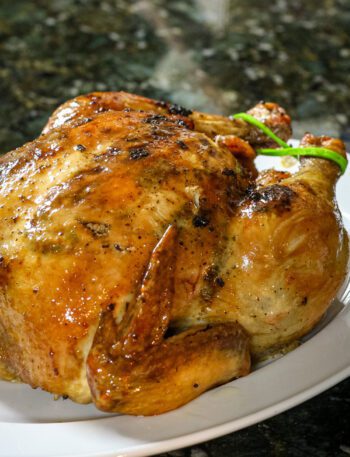 a sriracha glazed roast chicken on a platter