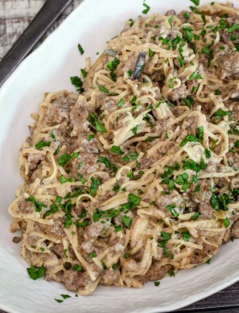 ground beef stroganoff with noodles in a serving dish