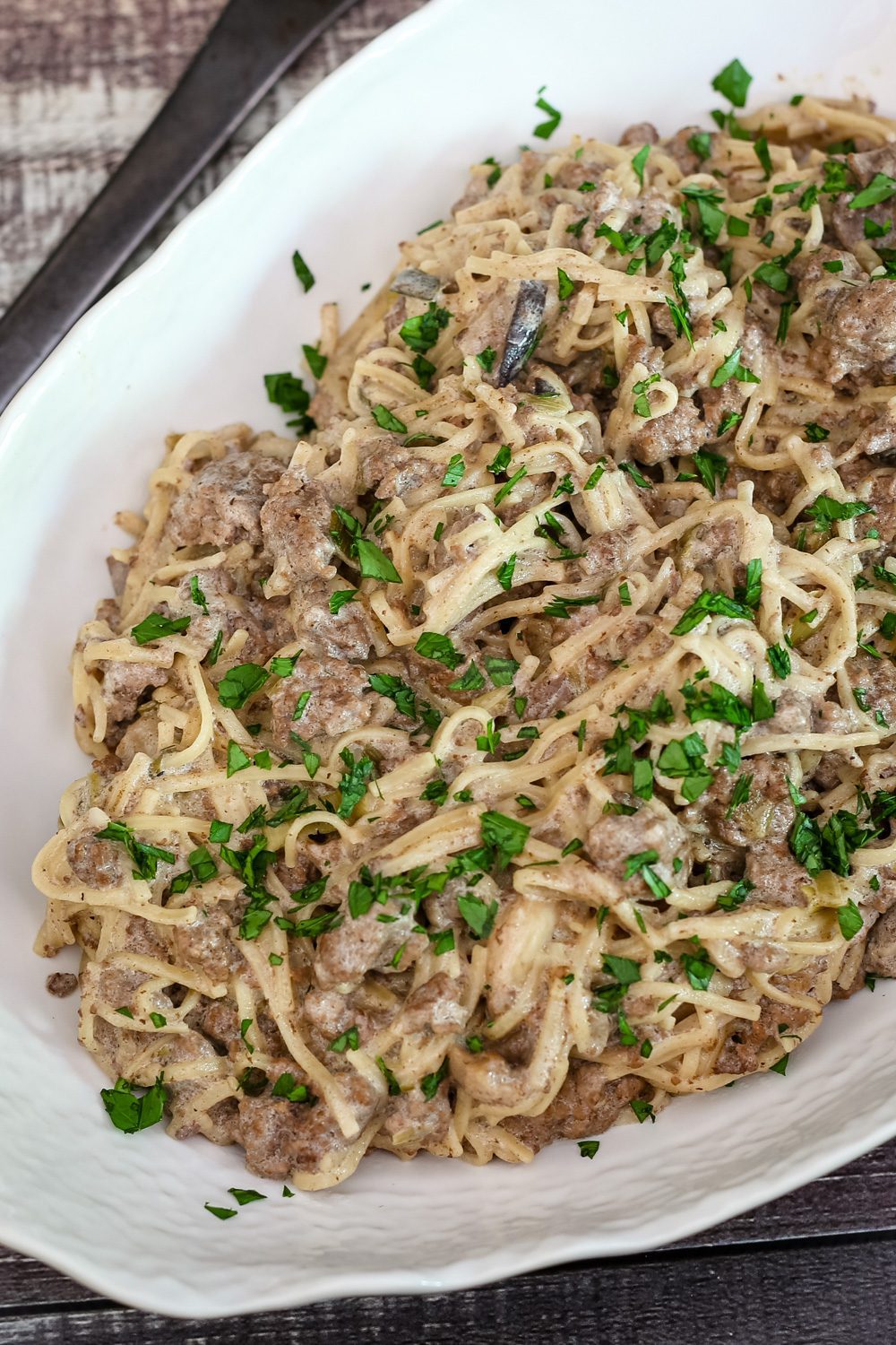 ground beef stroganoff with noodles in a serving dish
