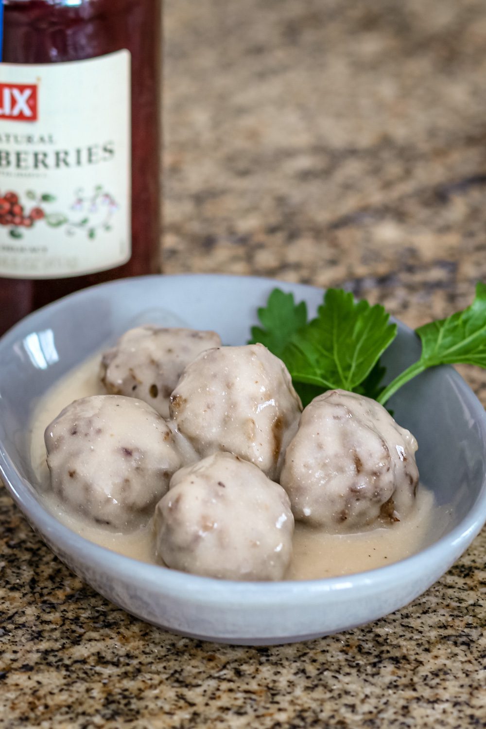 Swedish meatballs in a bowl with parsley