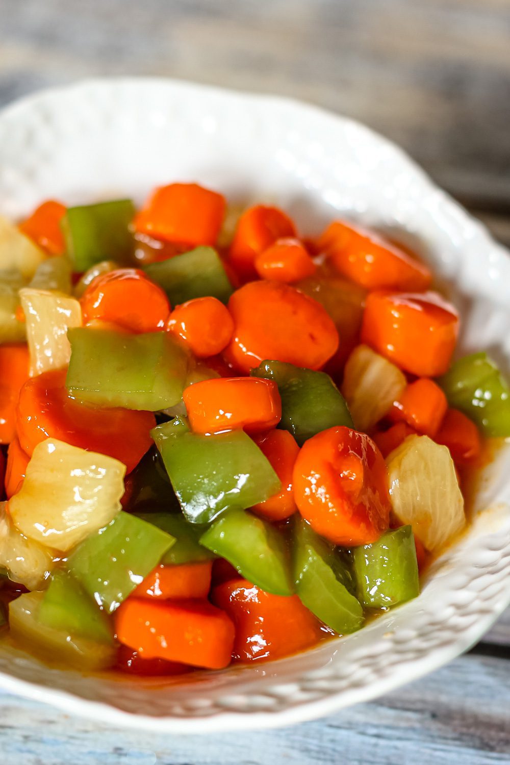 a serving bowl with sweet and sour carrots